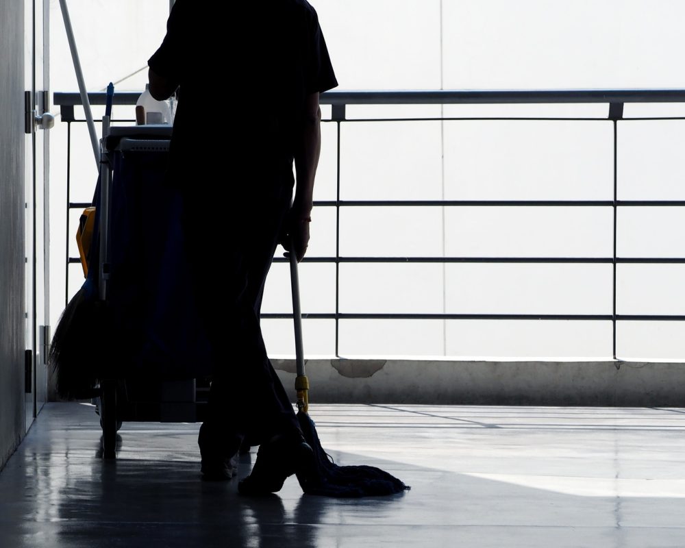 Silhoutte images of cleaning service man staff working on building